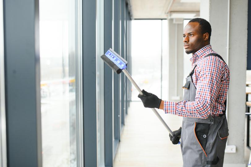 A window cleaner cleaning a high-rise building