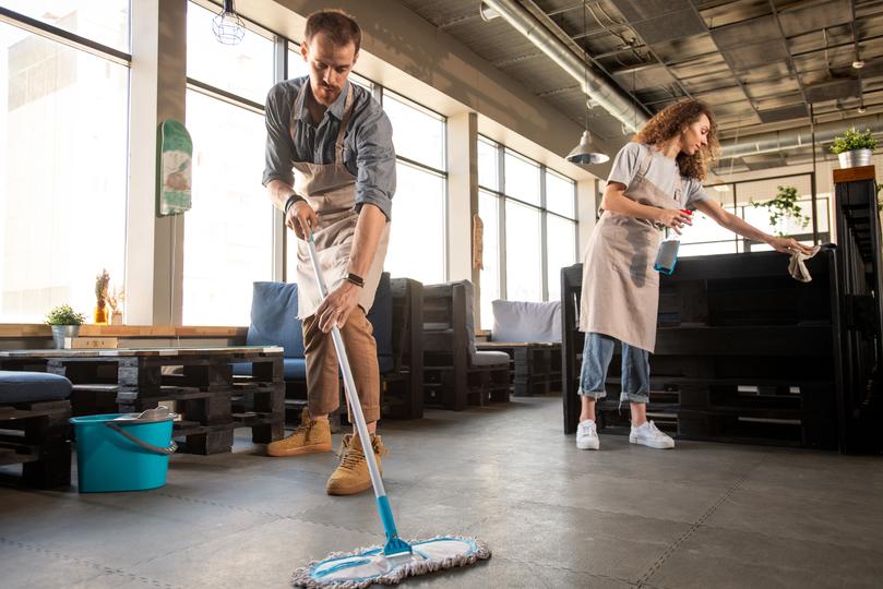 Commercial cleaners cleaning an office space