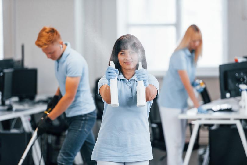 Commercial cleaners cleaning an office space